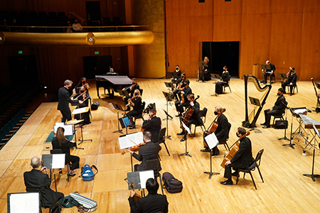 Utah Symphony musicians are socially distant while performing in Salt Lake City's Abravanel Hall during the Covid-19 pandemic.