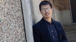 Tao Gao holding a block of iron